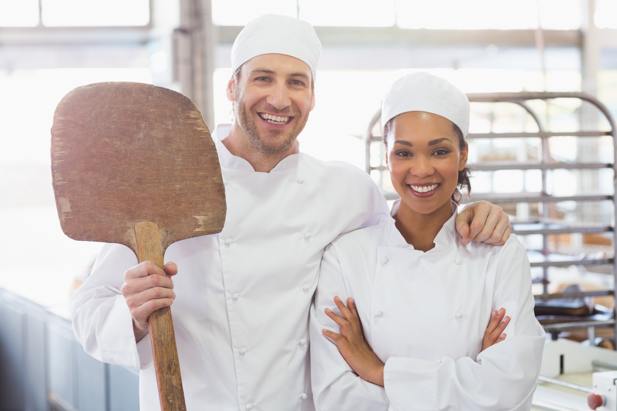 Team of chefs smiling in kitchen