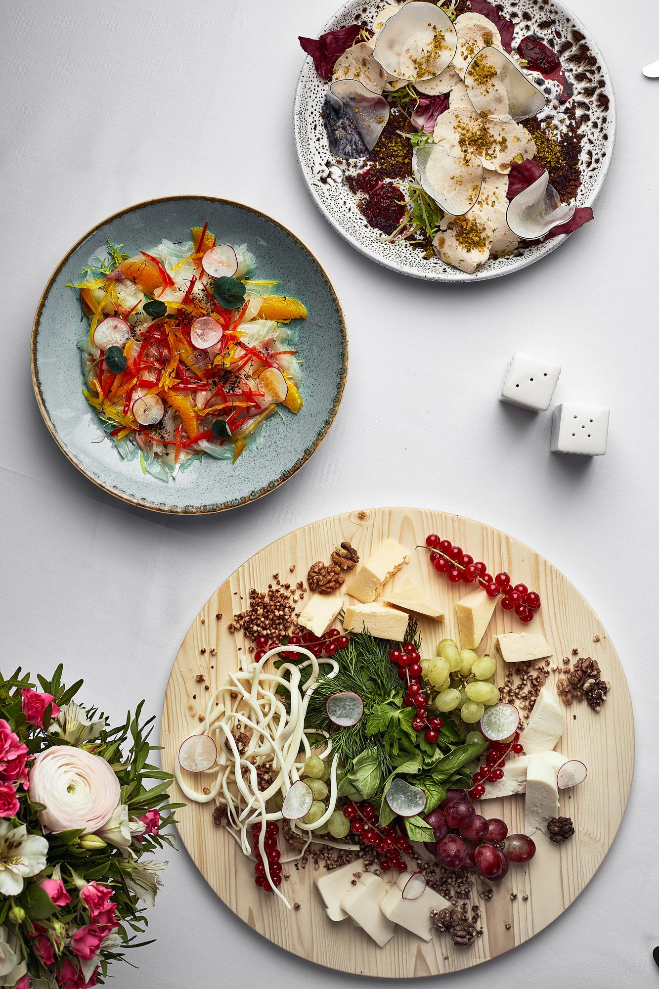 Assorted plated dishes on wooden table